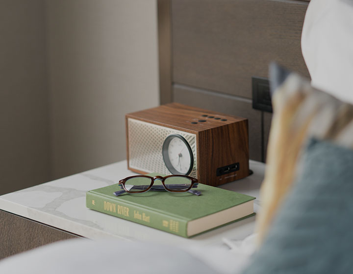 books and glasses on hotel side table